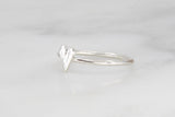 Sterling silver hammered elongated heart ring side view.