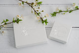 eco friendly Oorla Jewellery branded gift box, white with flecks and silver foil brand photographed with spring blossom