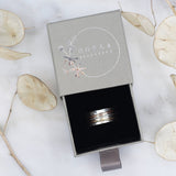 Triple banded spinner ring