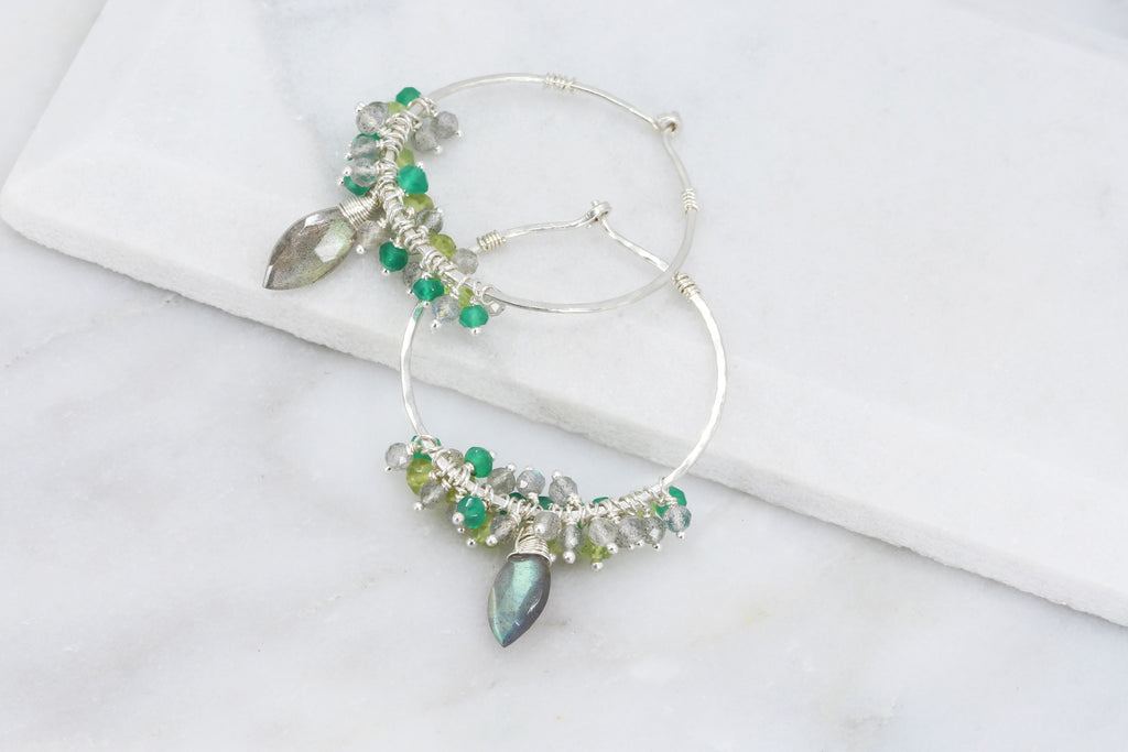Hammered stering silver hoop earrings with clusters of shimmering faceted bright green onyx, lime green peridot and iridescent labradorite and a central wire wrapped faceted marquise labradorite with amazing flash.t 
