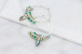 Hammered stering silver hoop earrings with clusters of shimmering faceted bright green onyx, lime green peridot and iridescent labradorite and a central wire wrapped faceted marquise labradorite with amazing flash.t 
